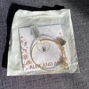 Brand new in package gold love Alex and Ani bracelet